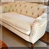 F05. Custom upholstered tufted love seat with textured fabric. 31”h x 64”w x 36”d - $750 